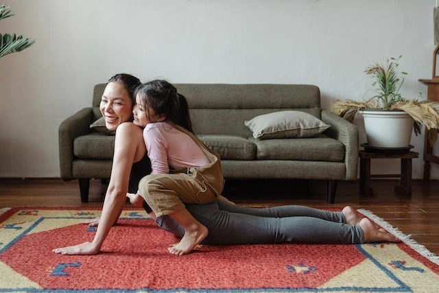 mother and child doing exercises on the floor