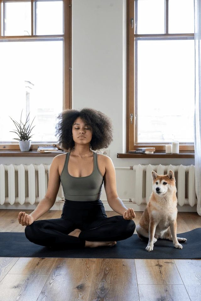 woman cross legged, meditating